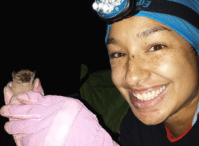 University of Toronto PhD student Cylita Guy holding a bat in High Park